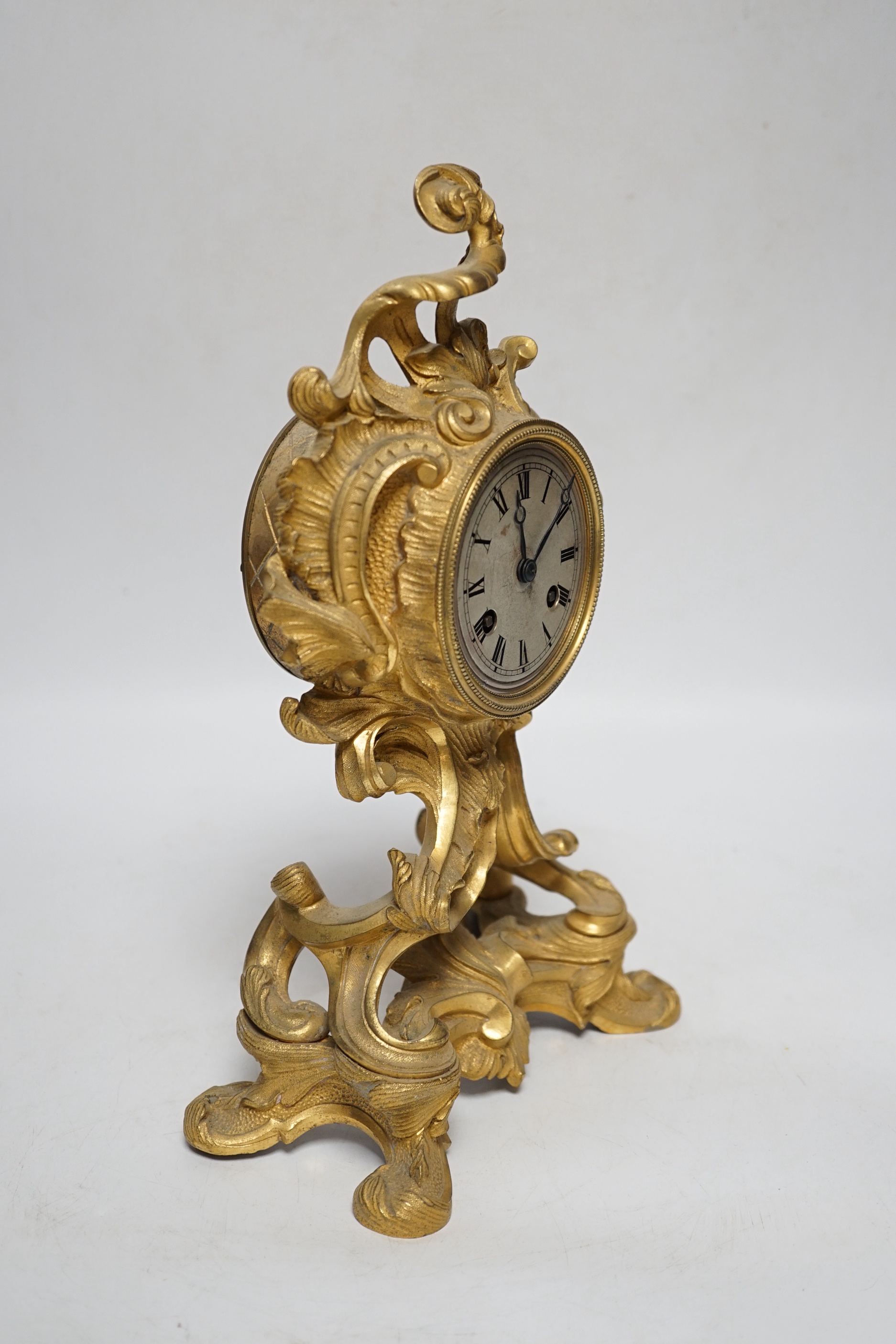 A 19th century French rococo-style ormolu mantel clock with Raingo movement striking on a bell (missing pendulum), 29cm